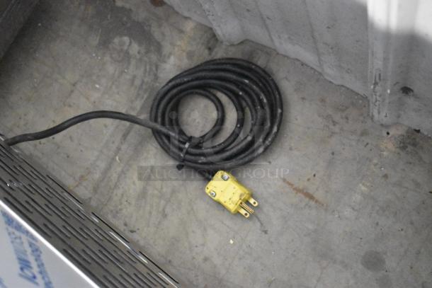 Piper Products RCM054S stainless steel blast chiller, 208-230V, 1-phase, with coiled power cable and yellow plug, brand new with minor scratches.