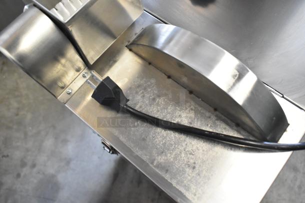 Stainless steel commercial countertop cookie depositor with power cord, featuring sturdy construction and clean surface.