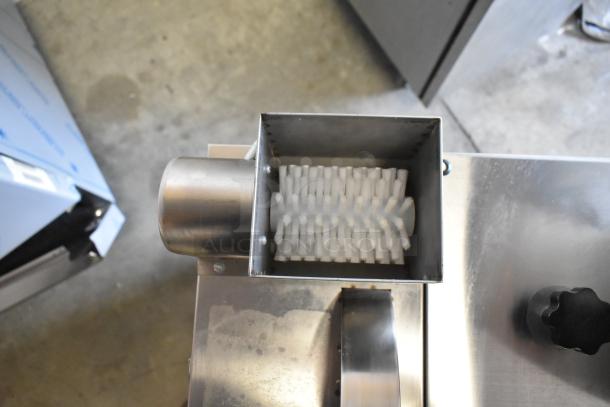 Stainless steel commercial countertop cookie depositor with visible hopper and controls; clean condition.