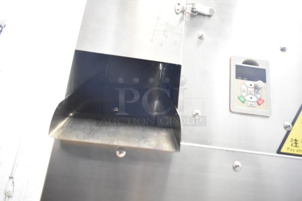 Stainless steel commercial countertop cookie depositor, featuring control panel and chute, in excellent condition.