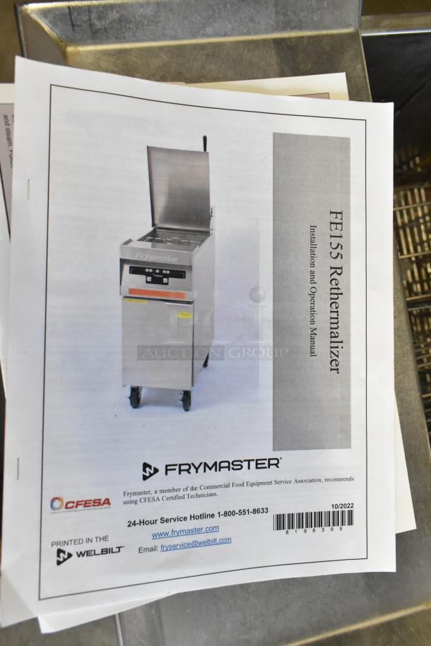 Frymaster stainless steel commercial rethermalizer on casters, featuring a control panel, installation manual visible.
