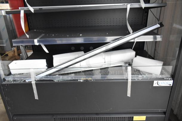 Avantco black extra deep vertical open air merchandiser, model 193VOA48B. Brand new, glass damage visible, LED lighting.
