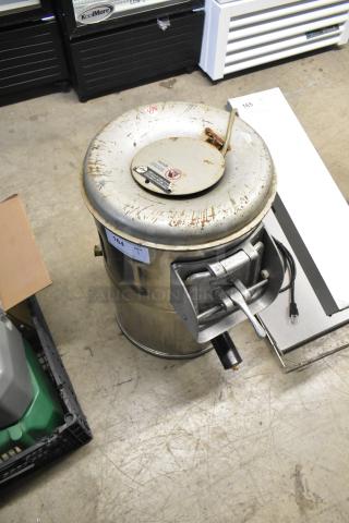 Univex metal commercial potato peeler, 115 volts, 1 phase. Visible wear and labels, sturdy construction ideal for high-volume use.