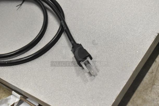 Hatco GRFFB metal commercial food strip warmer, 120 volts, 1 phase, black power cord with plug, on metal surface.