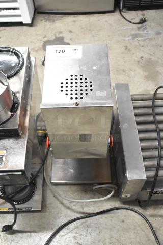Stainless steel unit, 115 volts, 1 phase, in used condition. Features ventilation holes and a red control knob.