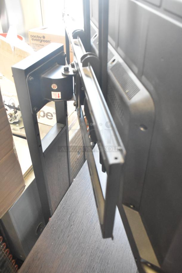 Samsung television on sturdy stand, close-up of mount. Local pickup only. Good condition. No shipping available.