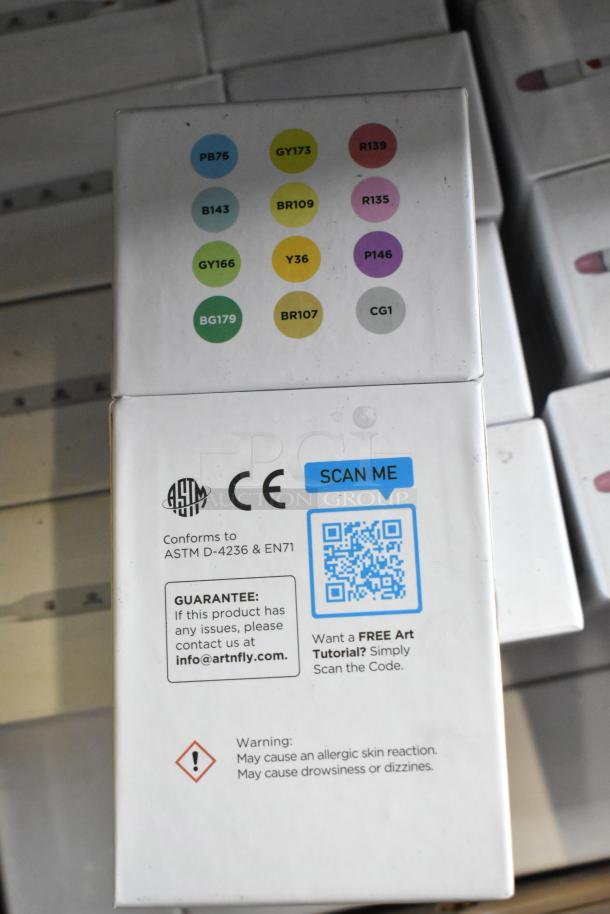 Art-n-fly 12 Brush Markers set, showing color codes and labels. Box indicates safety standards and a QR code for tutorials.