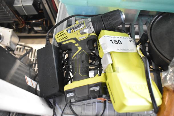 Ryobi HJP003 Drill/Driver with a bit set. Visible battery, charger, and auction label number 180.