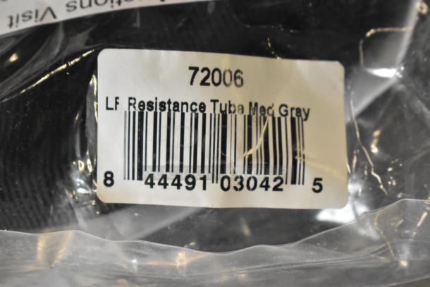 Resistance tube in medium gray with barcode label, item code 72006. Included in a lot with metal saucepan and Stanley mitre box.