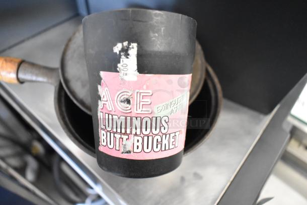 3 various items: resistance tube, metal saucepan, and Stanley mitre box; featuring a "Luminous Butt Bucket."