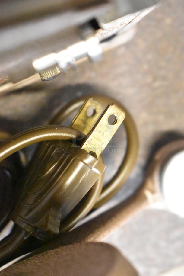 Craig KE-8 Projecto-Editor plug close-up, showing two-prong connector for 110-120 volts, 1 phase in hard case.