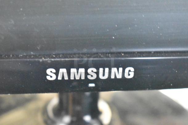 Three monitors including Asus VG249, Samsung S23C350H, and HP. Visible: Samsung logo. Monitors in good condition. Auction offers 3 times your bid.