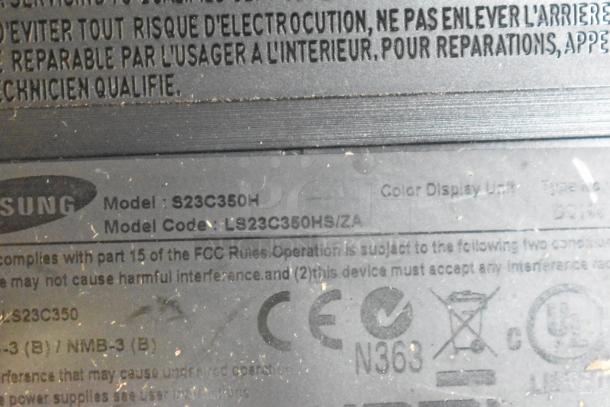Close-up of Samsung S23C350H monitor label, model code LS23C350HS/ZA, showing compliance markings.