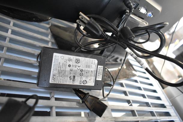 Three monitors: Asus VG249, Samsung S23C350H, and HP. Power cables and labels visible, good condition, bundled auction item.