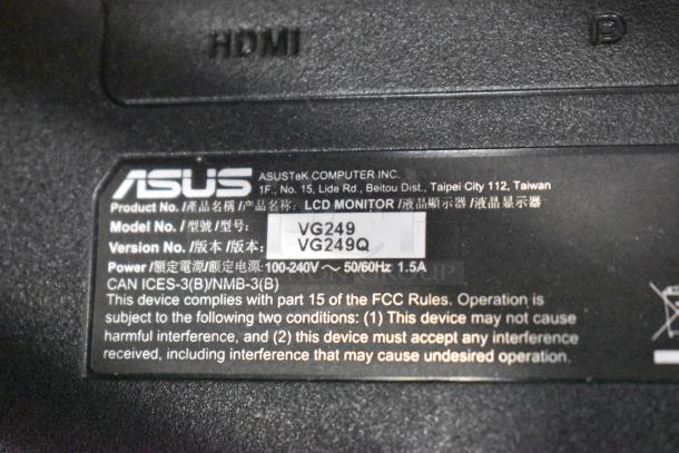 Label on Asus monitor showing model VG249, indicating compliance with FCC rules. 100-240V power input.