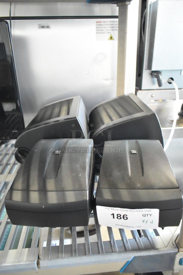 Four Yamaha NS-AW150 8 ohm speakers, black, used condition, auction label marked "186."