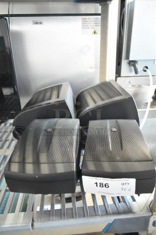 Four Yamaha NS-AW150 8 ohm speakers, black, used condition, auction label marked "186."