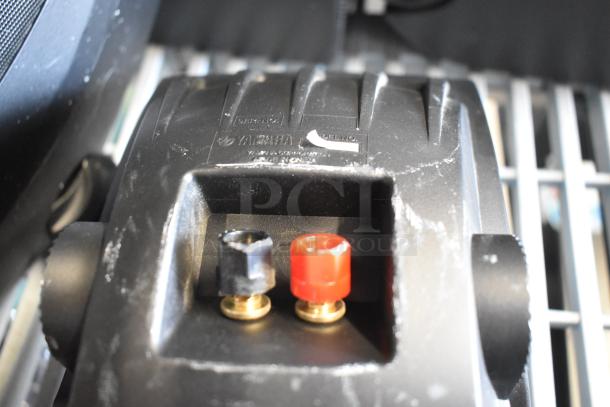 4 Yamaha NS-AW150 speakers, 8 ohm, shown with input connectors. Surface shows minor wear. Logo and model details visible.