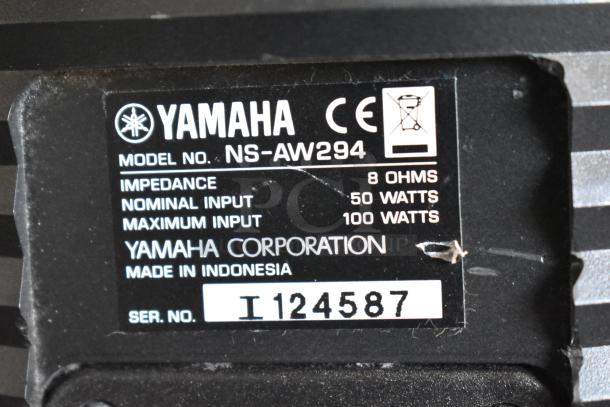 Label on Yamaha NS-AW294 speaker showing 8 ohm impedance, 50W nominal, 100W max input, made in Indonesia, serial I124587.