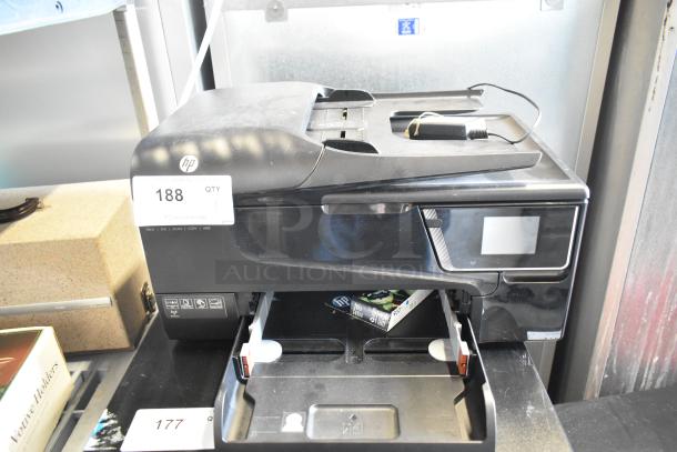HP countertop printer scanner copier machine, black, with visible auction tag numbered 188. Multi-function device.