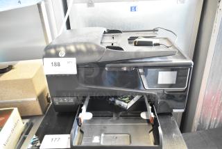 HP countertop printer scanner copier machine, black, with visible auction tag numbered 188. Multi-function device.