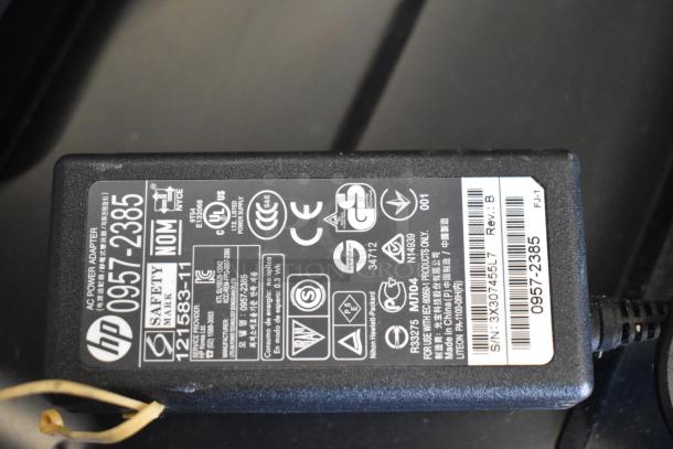 HP power adapter for Countertop Printer Scanner Copier, model 0957-2385, showing safety certifications and specifications.