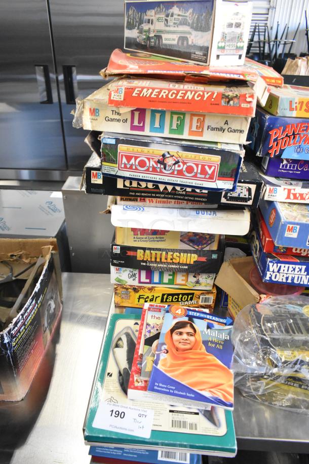 Tier lot of board games and books, including "Monopoly," "The Game of Life," and "Battleship." Mixed condition.