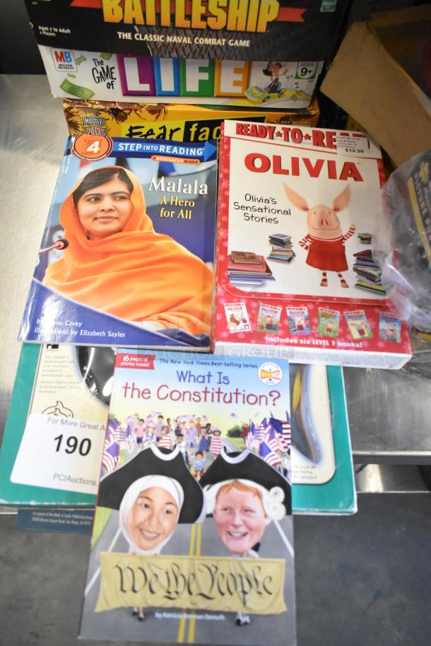 Tier lot with board games and books, including "Battleship," "The Game of Life," "Malala: A Hero for All," and "Olivia" stories.