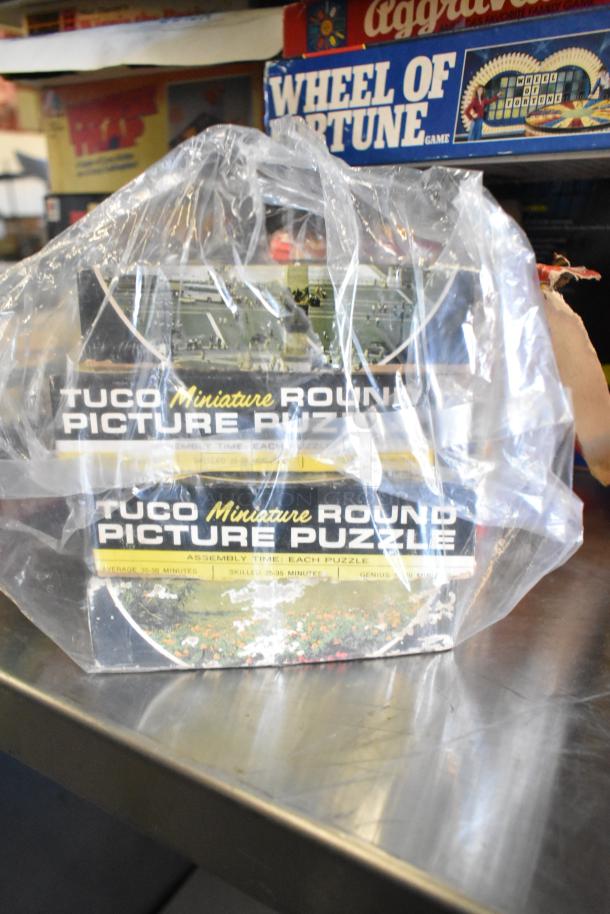Tier lot including "Wheel of Fortune" board game, Tuco Miniature Round Picture Puzzle in plastic wrap, used condition.