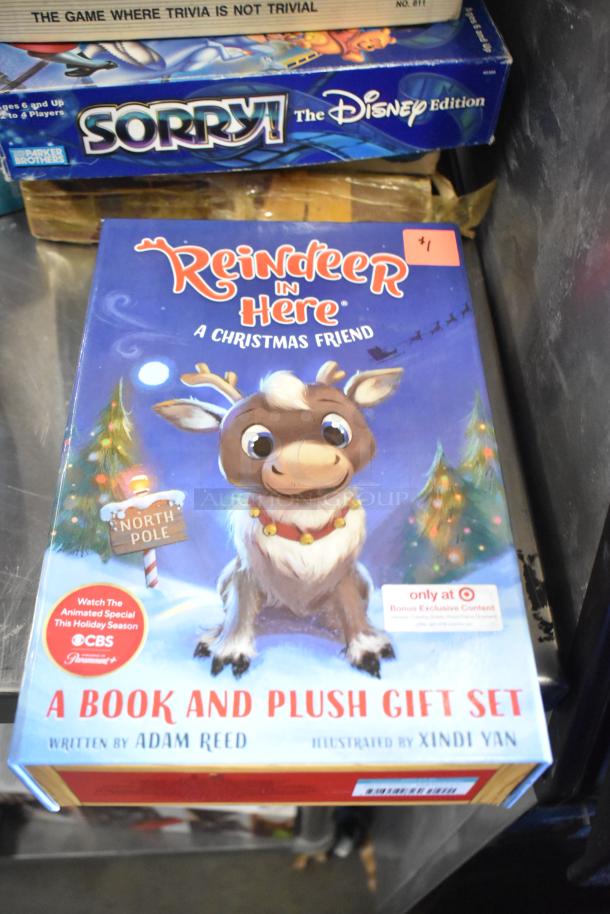 Tier lot including "Reindeer in Here" book and plush set, "Sorry! The Disney Edition" board game, in good condition.