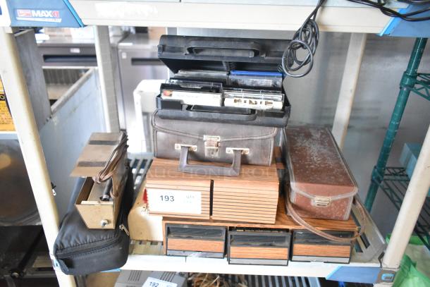 Eight assorted items, including a Marsand bag, cassette tapes, and a mailbox. Condition varies; bidding increases value.