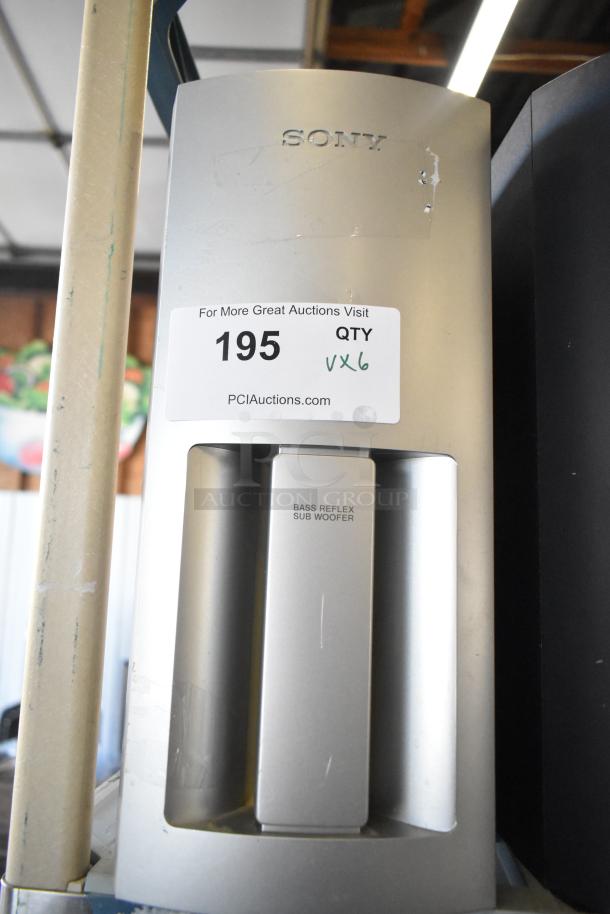 Sony bass reflex subwoofer in silver, marked with item label "195" and "QTY VX6," indicating auction lot of six items.
