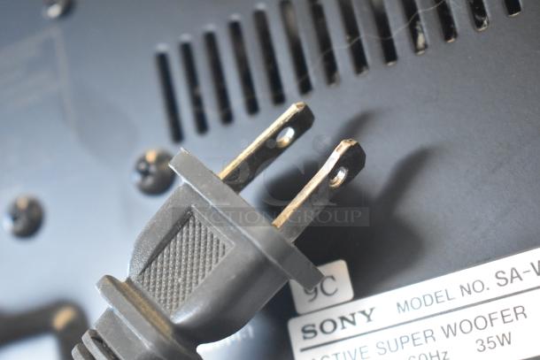 Sony Active Super Woofer Model SA-W; 35W, 60Hz. Close-up of plug and label. In good condition.
