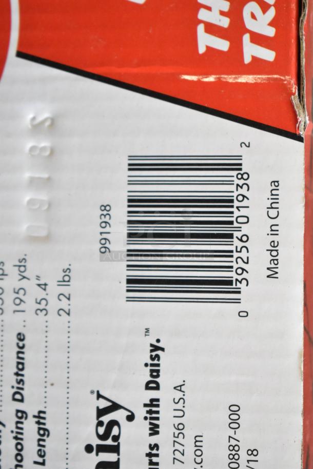 Red Ryder BB Gun box with Daisy branding and barcode. Includes weight plates. New condition. Made in China.