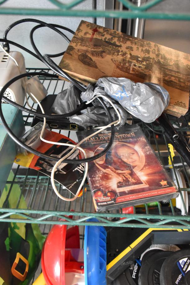 Two-tier lot including a variety of items such as fishing lures, windchimes, DVD, and Nintendo Switch controller holder. Mixed condition.