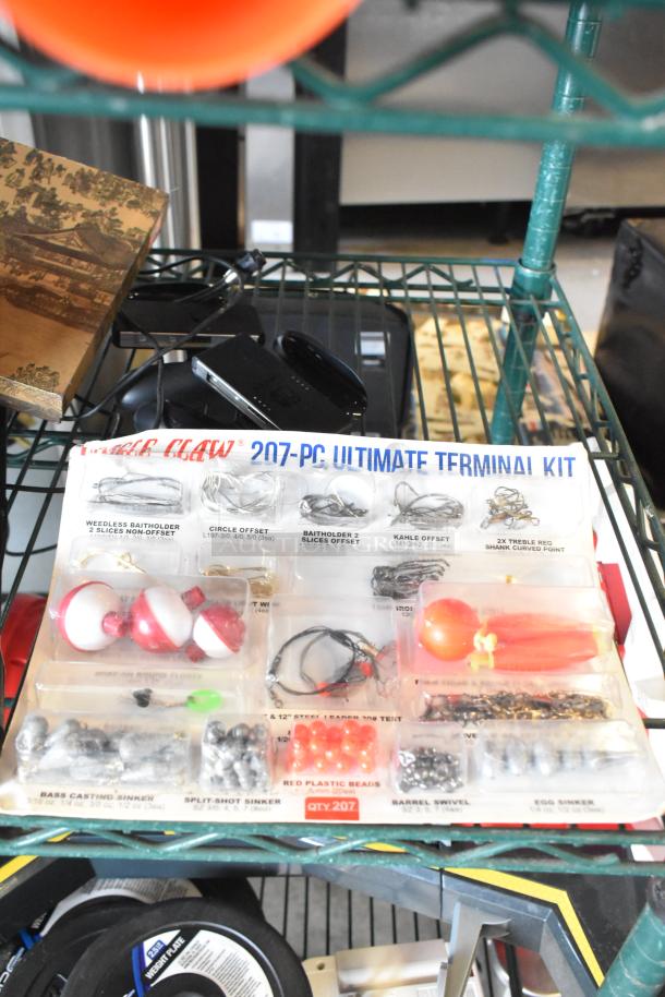 Two-tier lot featuring fishing lures, a Nintendo Switch controller holder, and windchimes on a metal shelf.