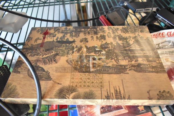 Two-tier lot with assorted items: fishing lures, wind chimes, and a Nintendo Switch controller holder on a metal shelf.