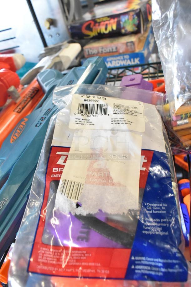 Two-tier lot with various items including Nerf toy guns and board games. Visible labels: SKU 79193, barcode, and "Made in China."