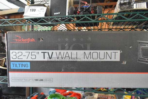 Rocketfish 32-75" tilting TV wall mount box, slightly worn. Suitable for TVs up to 130 lbs. Additional items like toy guns visible.