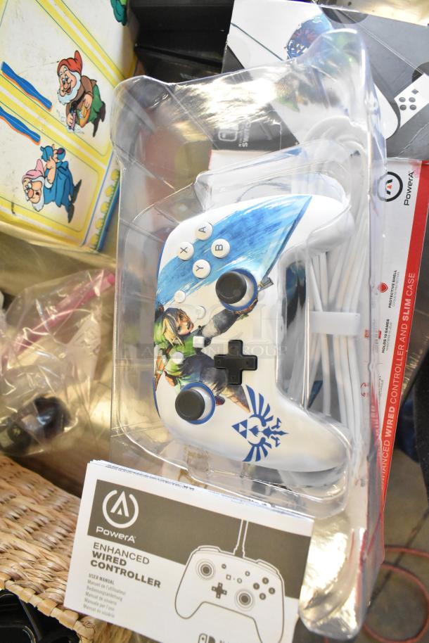 PowerA Enhanced Wired Controller featuring Zelda artwork, in packaging. Includes user manual. Part of a mixed item lot.