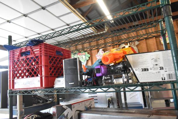 Two-tier shelf with Sony speaker, Jacob doll, Star Wars Darth Vader doll, jerseys, and various items.