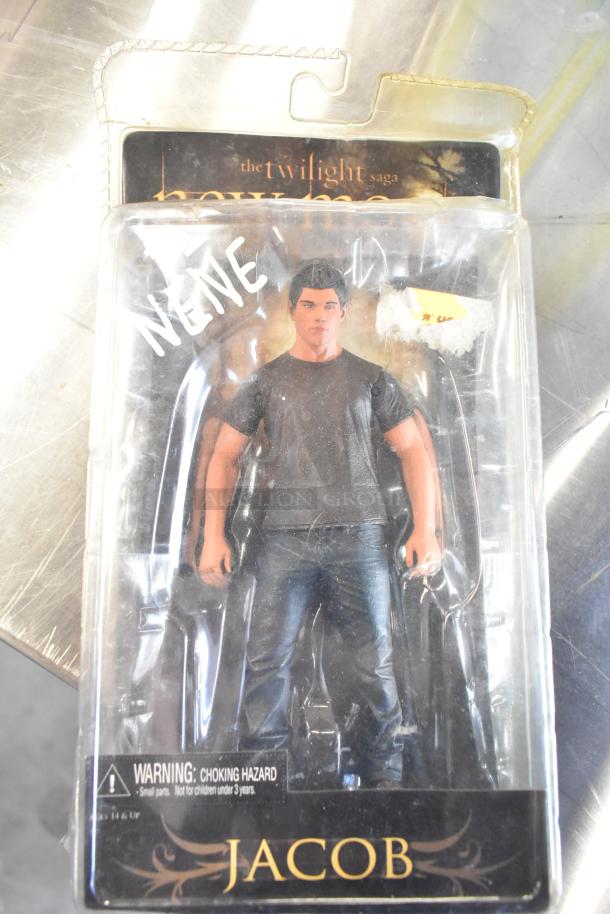 Twilight Saga Jacob doll in original packaging, marked "Nene," with slight wear. Choking hazard warning displayed.
