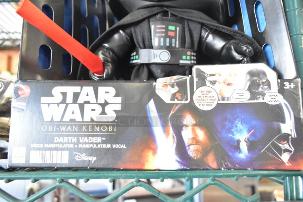 Star Wars Darth Vader doll in box with voice manipulator feature; packaging shows character images and "Try Me" label.
