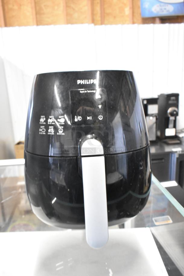 Philips HD9230 countertop air fryer, black, rapid air technology, 120V, used condition. Front control panel visible.