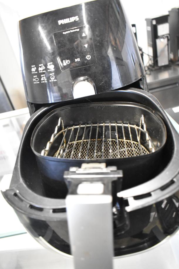 Philips HD9230 Air Fryer, black, open view showing cooking basket. 120 Volts, 1 Phase. Model HD9230. Good condition.