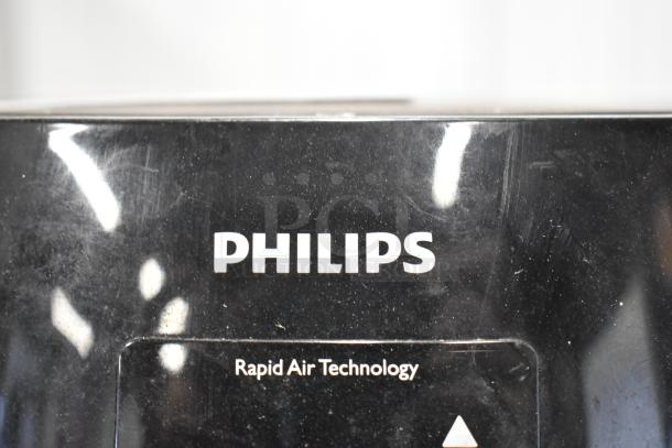 Philips HD9230 Air Fryer, featuring Rapid Air Technology. Black finish, visible surface wear. 120 Volts, 1 Phase.
