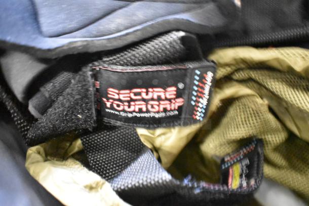 BagBoy bag interior showing a "Secure Your Grip" label. Contains jump rope, shoes. Ideal for gym use.