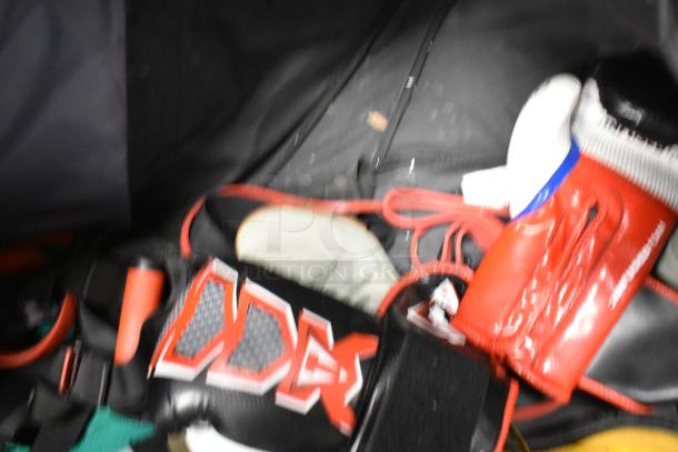 BagBoy sports bag with jump rope, red and black fitness shoes, and accessories inside. Good condition, various contents.