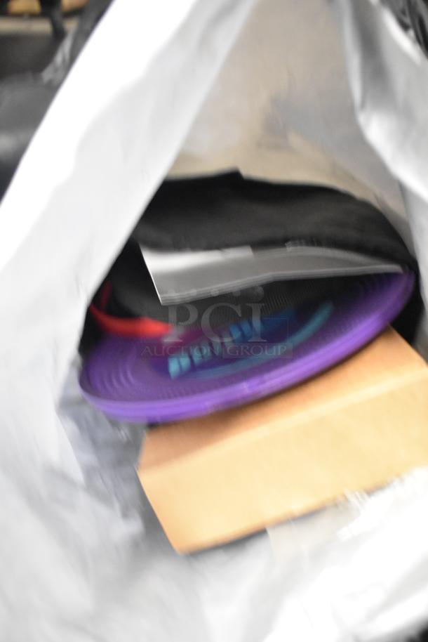 BagBoy bag with contents including a purple disc, red jump rope, and shoes. Items partially visible in open bag.