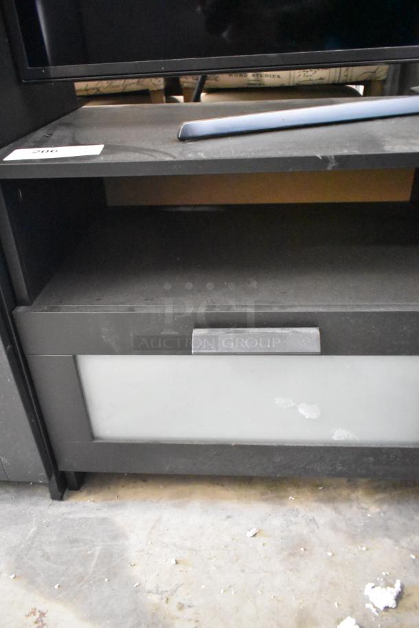 Samsung television with black stand, minor wear visible. Pick-up only. Auction includes 2 items; 2x bid offer.